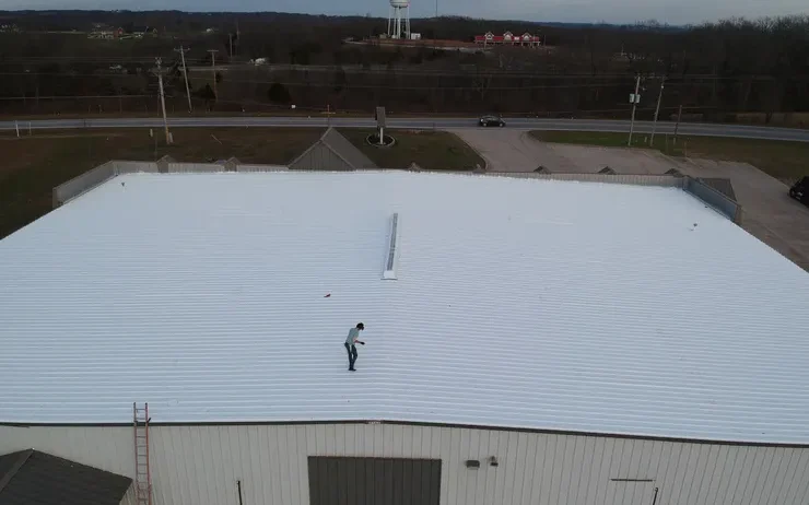 Clean up for silicone coating over metal roof in Branson, MO